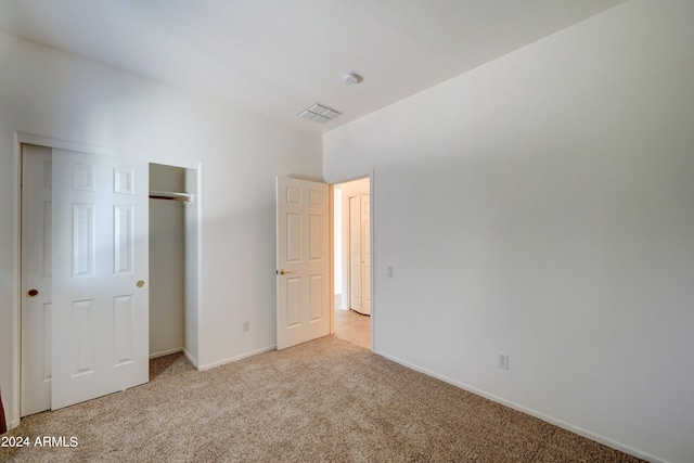 unfurnished bedroom with light carpet