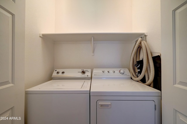 washroom with washer and dryer