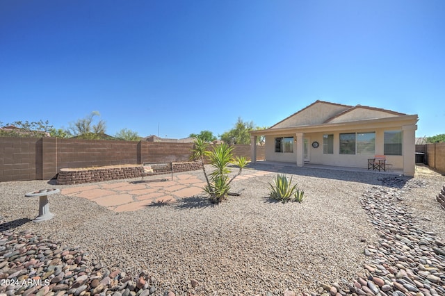 rear view of property with a patio