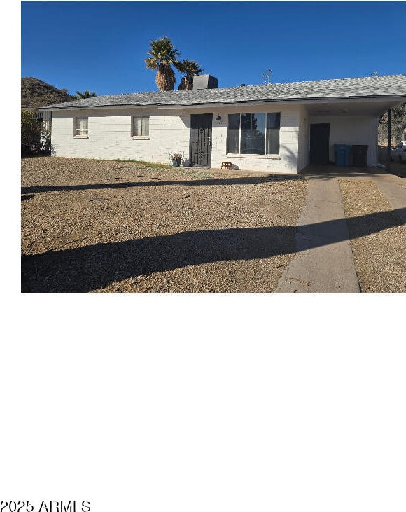 ranch-style home with a carport