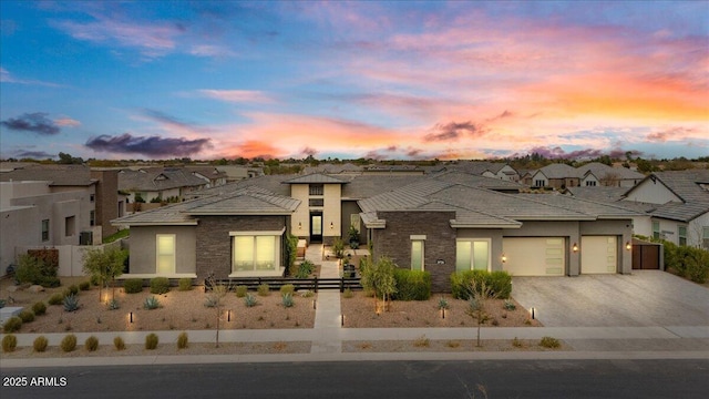 prairie-style home featuring a garage