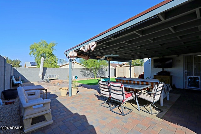 view of patio with a shed