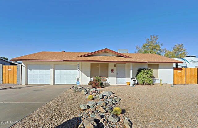 single story home with a garage