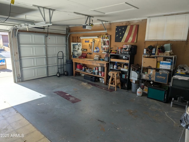 garage featuring a workshop area and a garage door opener