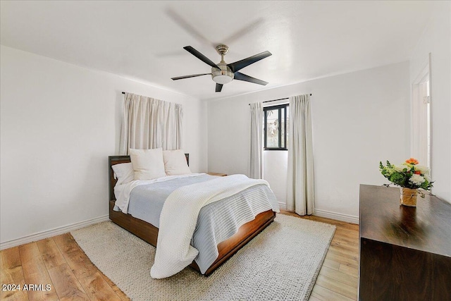 bedroom featuring light hardwood / wood-style floors and ceiling fan