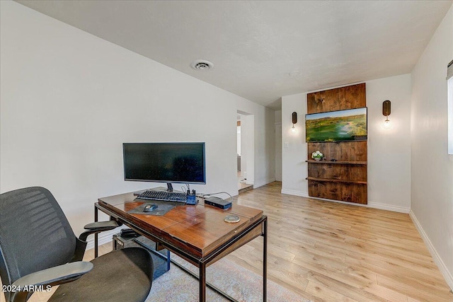 office with light wood-type flooring