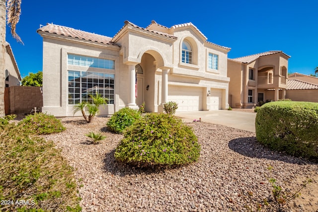 mediterranean / spanish-style house featuring a garage