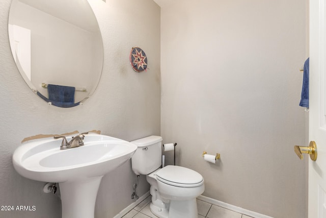 bathroom with tile patterned flooring and toilet