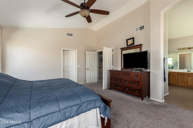 bedroom featuring high vaulted ceiling, ceiling fan, ensuite bathroom, and carpet floors