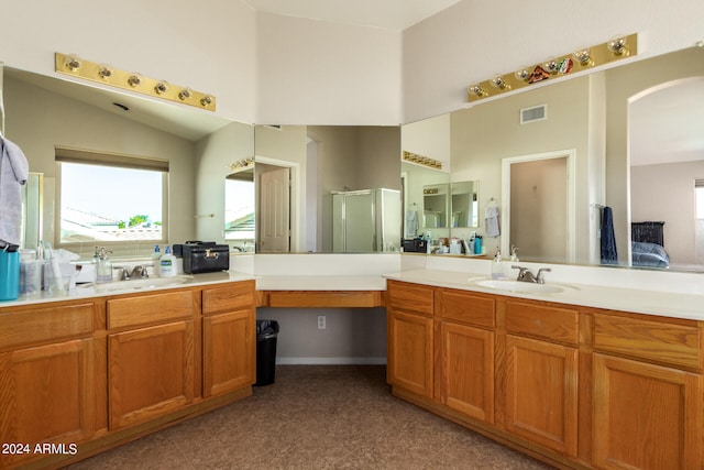 bathroom featuring walk in shower and vanity