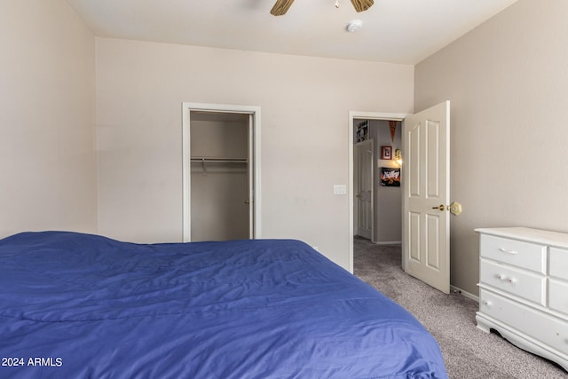 carpeted bedroom featuring a closet and ceiling fan