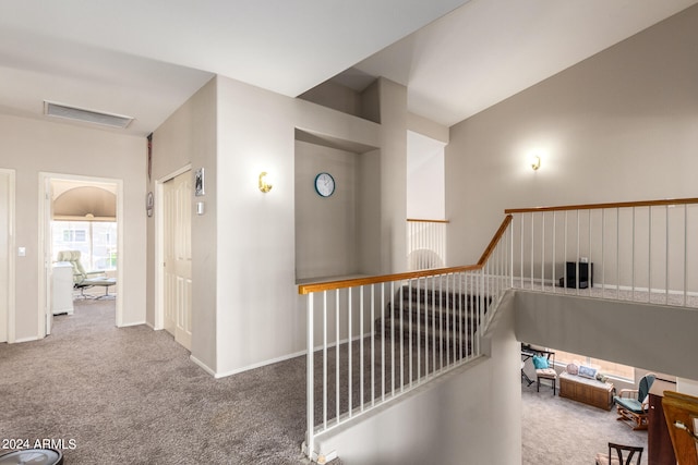 hallway with carpet floors