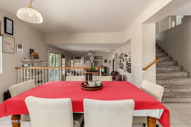 dining area featuring ceiling fan and light tile patterned floors