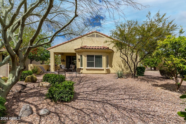 rear view of property with a patio area