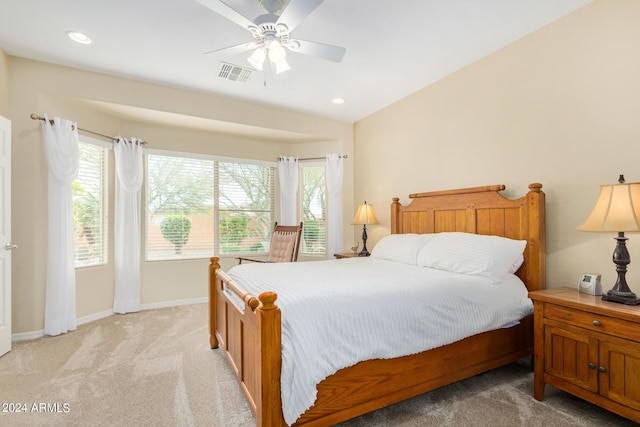 carpeted bedroom with ceiling fan and lofted ceiling