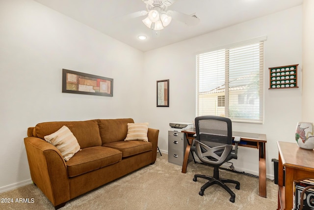 carpeted office featuring ceiling fan