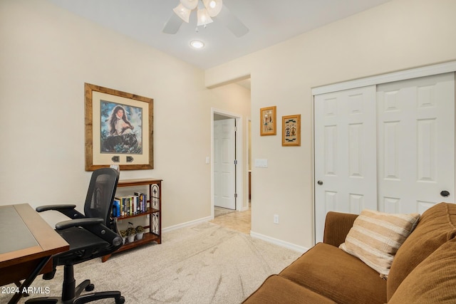 office featuring ceiling fan and light carpet