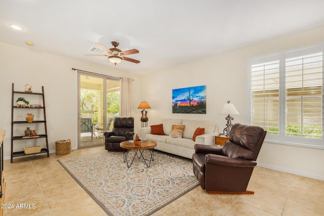 living room with light tile patterned floors and ceiling fan