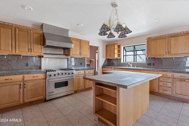 kitchen with backsplash, light tile patterned floors, designer stove, a kitchen island, and range hood