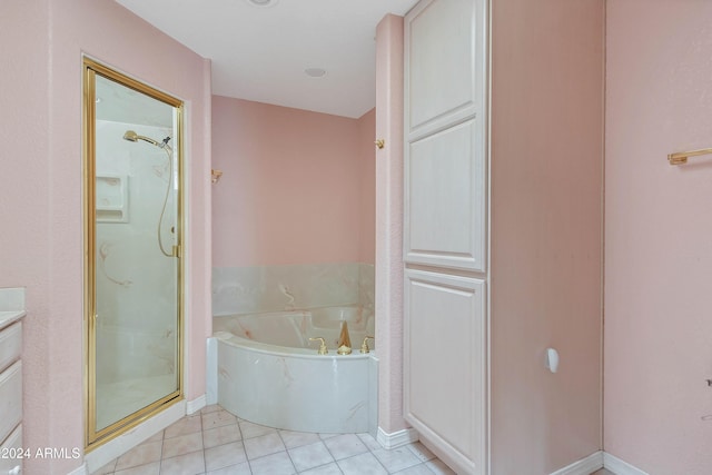 bathroom featuring tile patterned flooring, vanity, and independent shower and bath