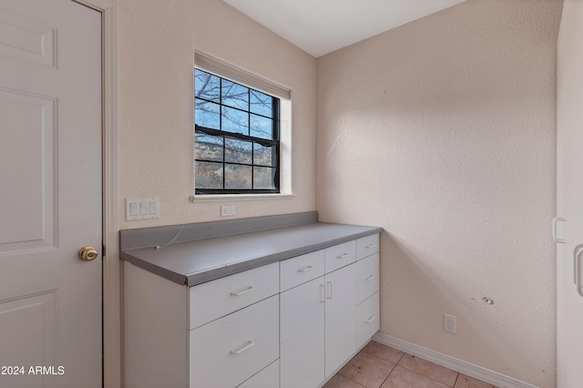 bathroom with tile patterned floors