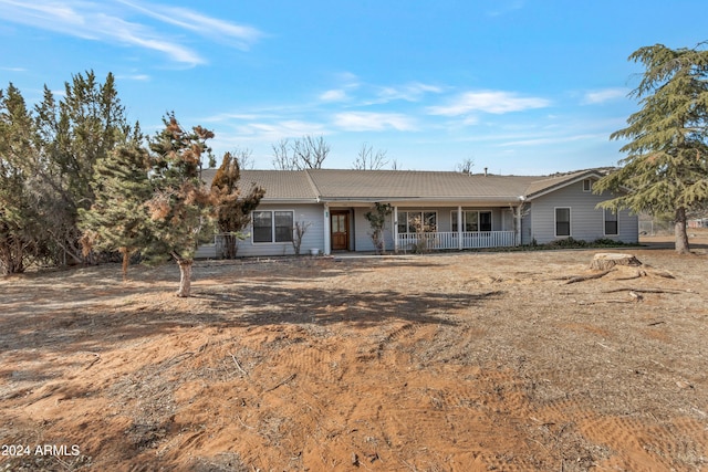 ranch-style house featuring a porch