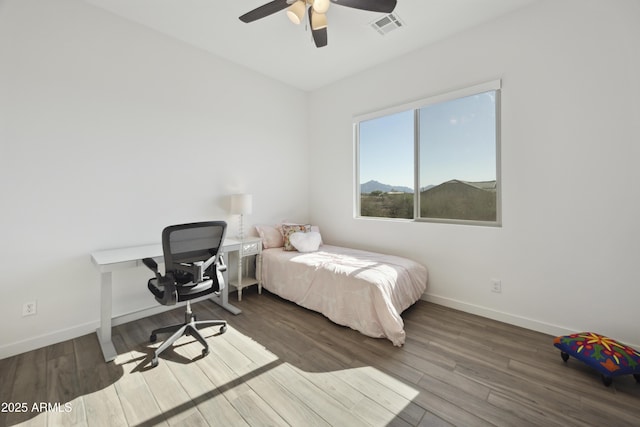 10540 S 32nd Dr, Laveen, AZ 85339 - bedroom with baseboards, wood finished floors, and a ceiling fan