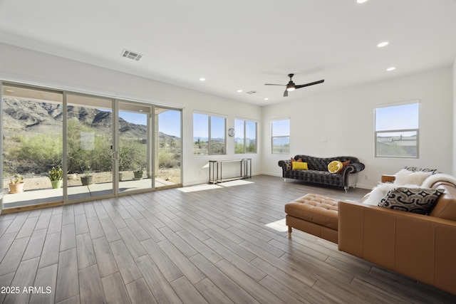 10540 S 32nd Dr, Laveen, AZ 85339 - living area with a ceiling fan, wood finished floors, recessed lighting, and baseboards
