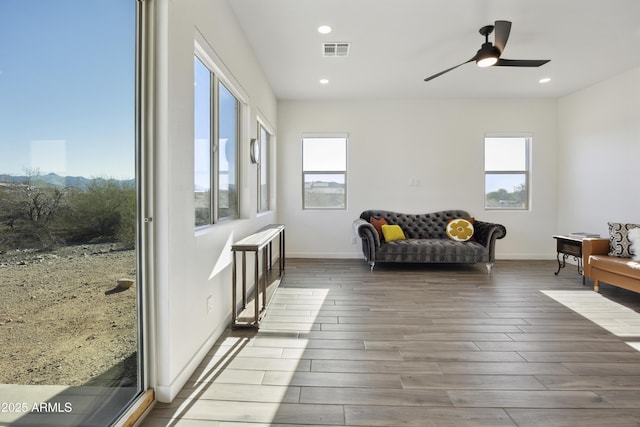 10540 S 32nd Dr, Laveen, AZ 85339 - living area featuring wood finished floors, ceiling fan, baseboards, and recessed lighting