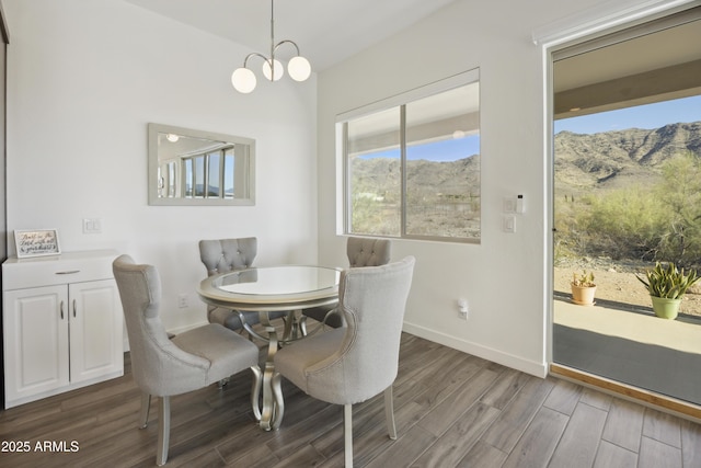 10540 S 32nd Dr, Laveen, AZ 85339 - dining space featuring a mountain view, dark wood-type flooring, and baseboards