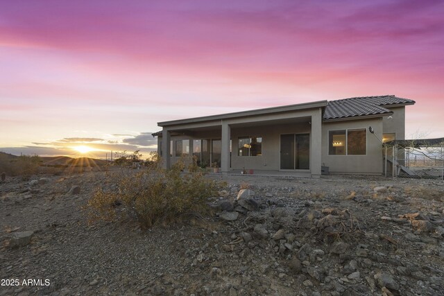 10540 S 32nd Dr, Laveen, AZ 85339 - back of property at dusk with stucco siding