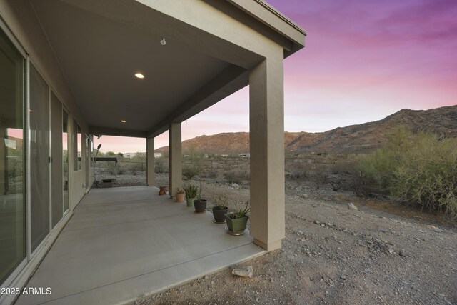 10540 S 32nd Dr, Laveen, AZ 85339 - patio terrace at dusk featuring a mountain view and a patio area