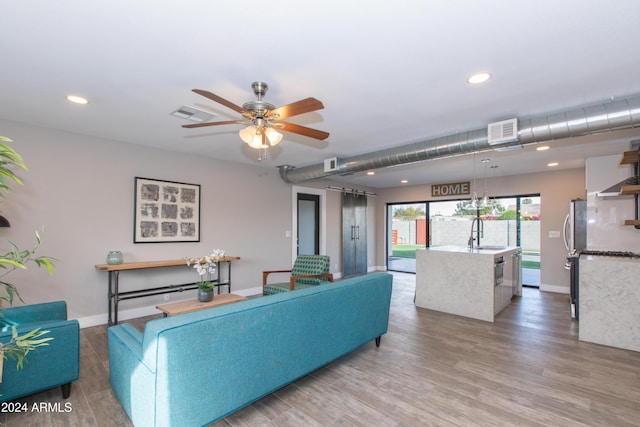 7544 E Mckinley St, Scottsdale, AZ 85257 - living area featuring ceiling fan, visible vents, and light wood-type flooring