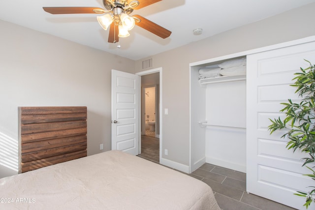 7544 E Mckinley St, Scottsdale, AZ 85257 - bedroom with dark tile patterned floors, a ceiling fan, visible vents, baseboards, and a closet