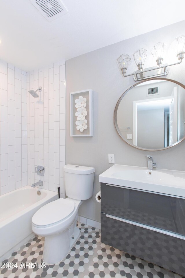 7544 E Mckinley St, Scottsdale, AZ 85257 - bathroom featuring visible vents, shower / bath combination, toilet, and vanity