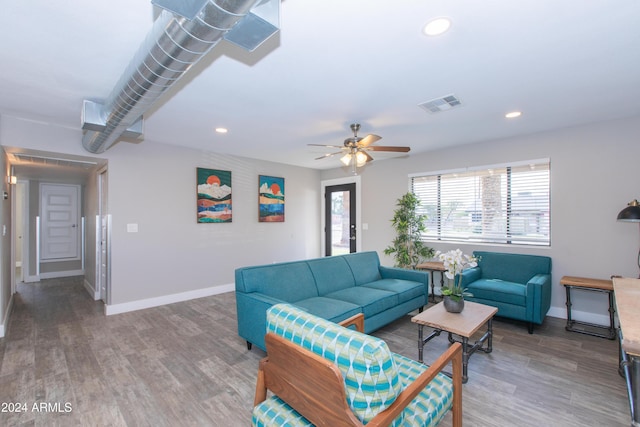 7544 E Mckinley St, Scottsdale, AZ 85257 - living room featuring baseboards, wood finished floors, and visible vents