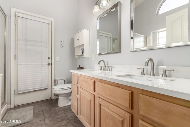 bathroom featuring toilet, walk in shower, tile patterned floors, and vanity