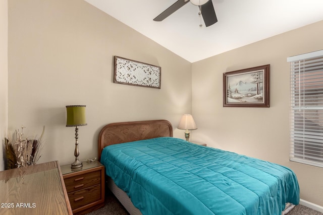 carpeted bedroom featuring vaulted ceiling and ceiling fan