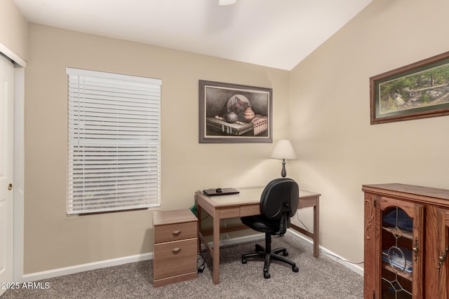 office with lofted ceiling and carpet floors