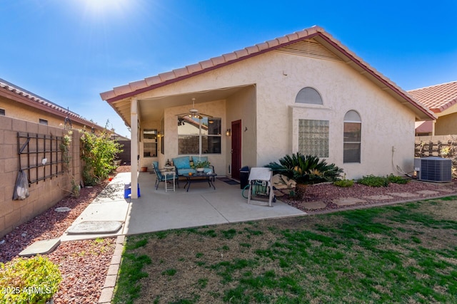 rear view of house featuring an outdoor hangout area, ceiling fan, a patio area, and cooling unit