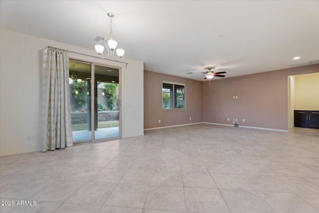 tiled empty room with ceiling fan with notable chandelier