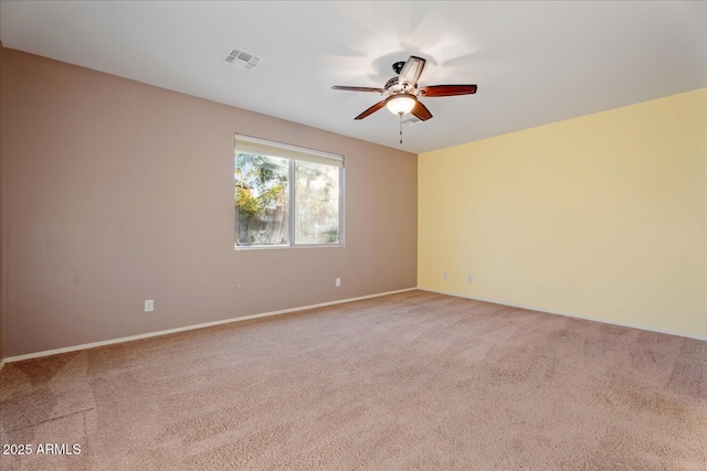 unfurnished room featuring ceiling fan and carpet floors