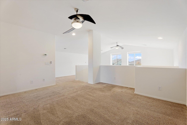 unfurnished room featuring ceiling fan, lofted ceiling, and light carpet