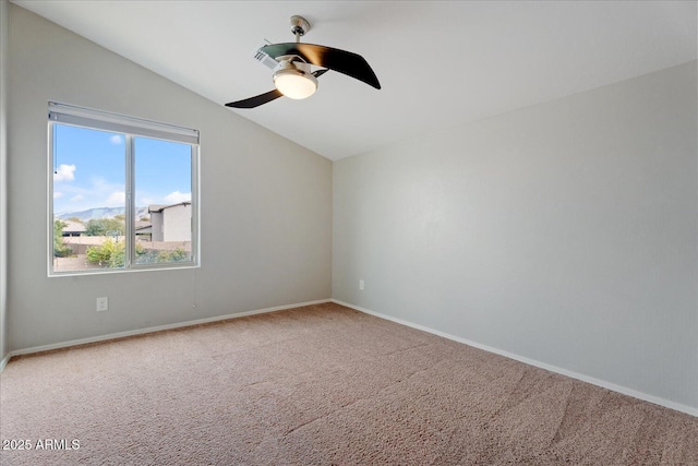 unfurnished room featuring ceiling fan, carpet flooring, and vaulted ceiling