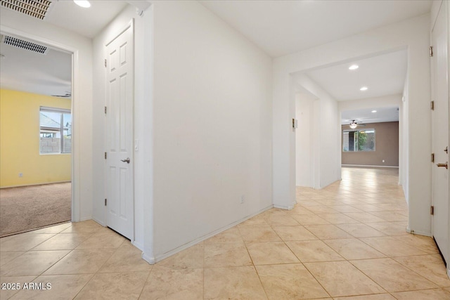 hallway with light tile patterned flooring