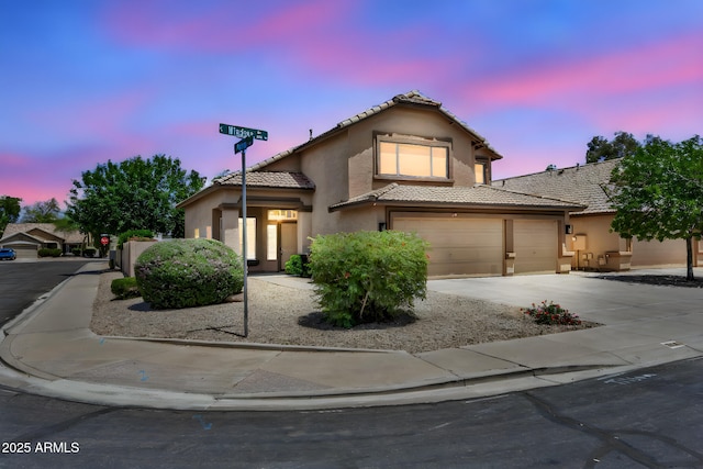 664 E Windsor Dr, Gilbert, AZ 85296 - view of front of property featuring stucco siding, a tiled roof, driveway, and a garage