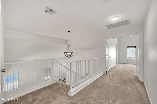 664 E Windsor Dr, Gilbert, AZ 85296 - corridor featuring an upstairs landing, carpet, and a chandelier