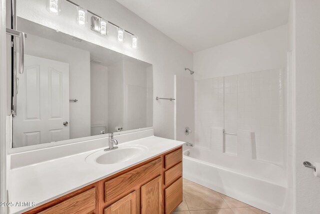 664 E Windsor Dr, Gilbert, AZ 85296 - full bathroom with tile patterned floors, toilet, vanity, and  shower combination