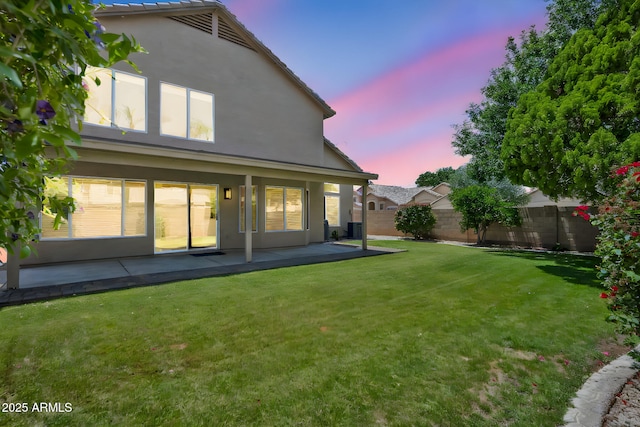 664 E Windsor Dr, Gilbert, AZ 85296 - back of house featuring stucco siding and a patio