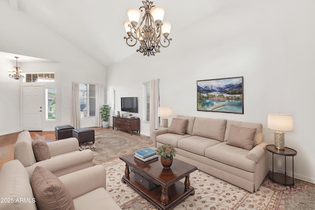 664 E Windsor Dr, Gilbert, AZ 85296 - living area featuring a chandelier, high vaulted ceiling, wood finished floors, and baseboards